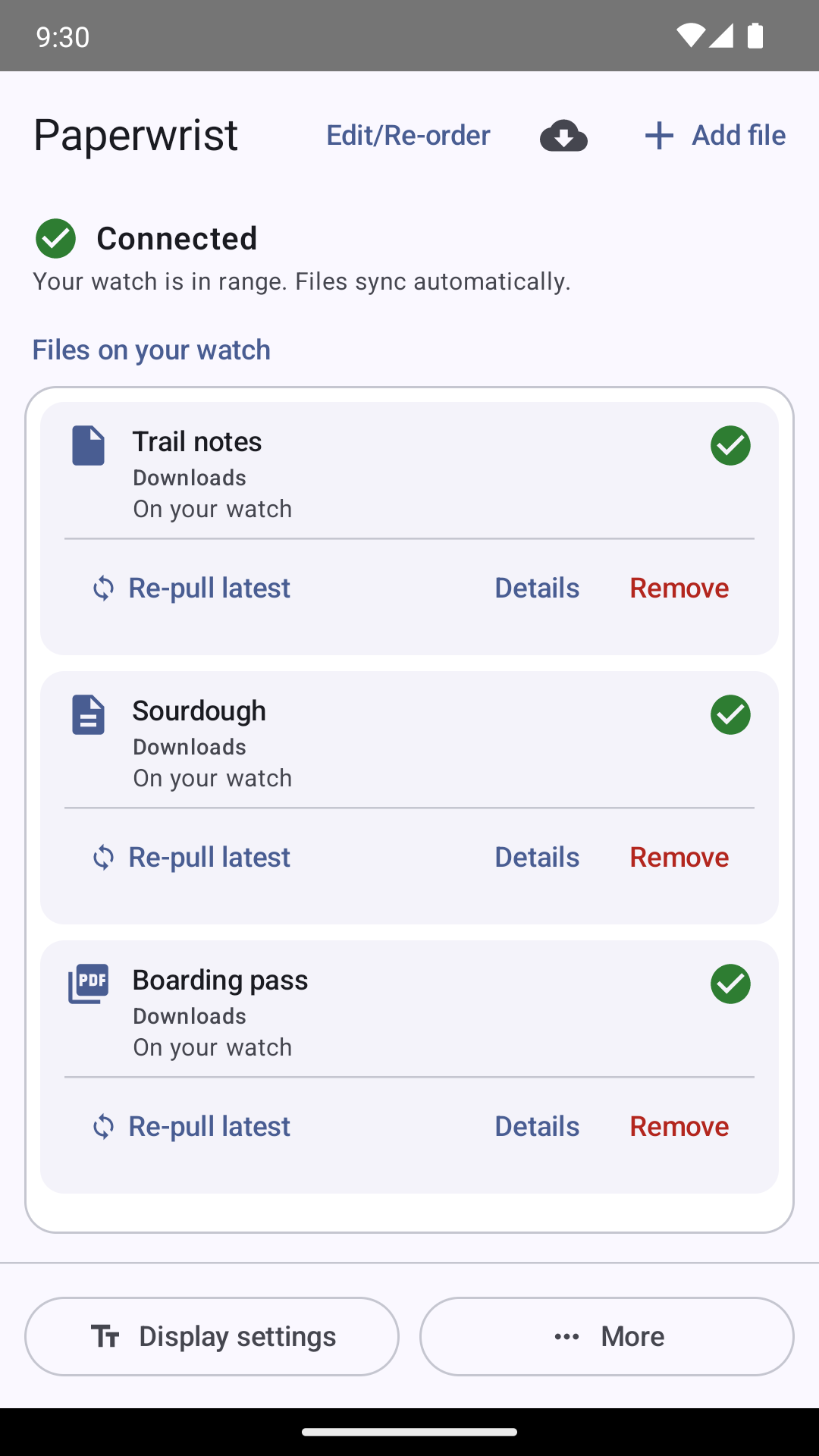 Paperwrist on an Android phone: 'Connected — your watch is in range. Files sync automatically', above cards for Trail notes, Sourdough and a Boarding pass PDF, each marked 'On your watch' with Re-pull latest, Details and Remove actions.